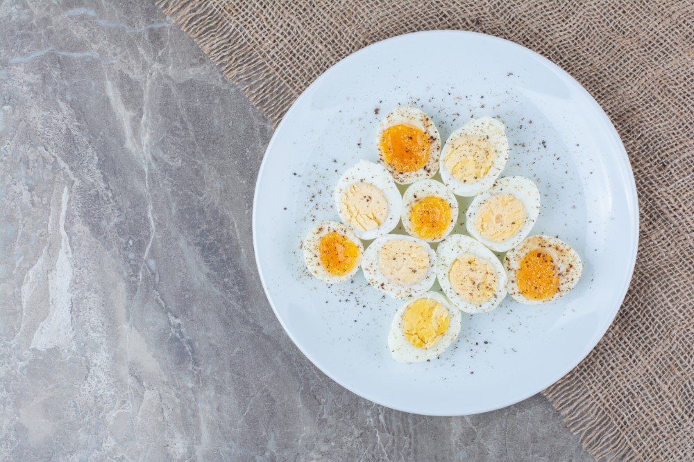 boiled tasty eggs with spices white plate high quality photo